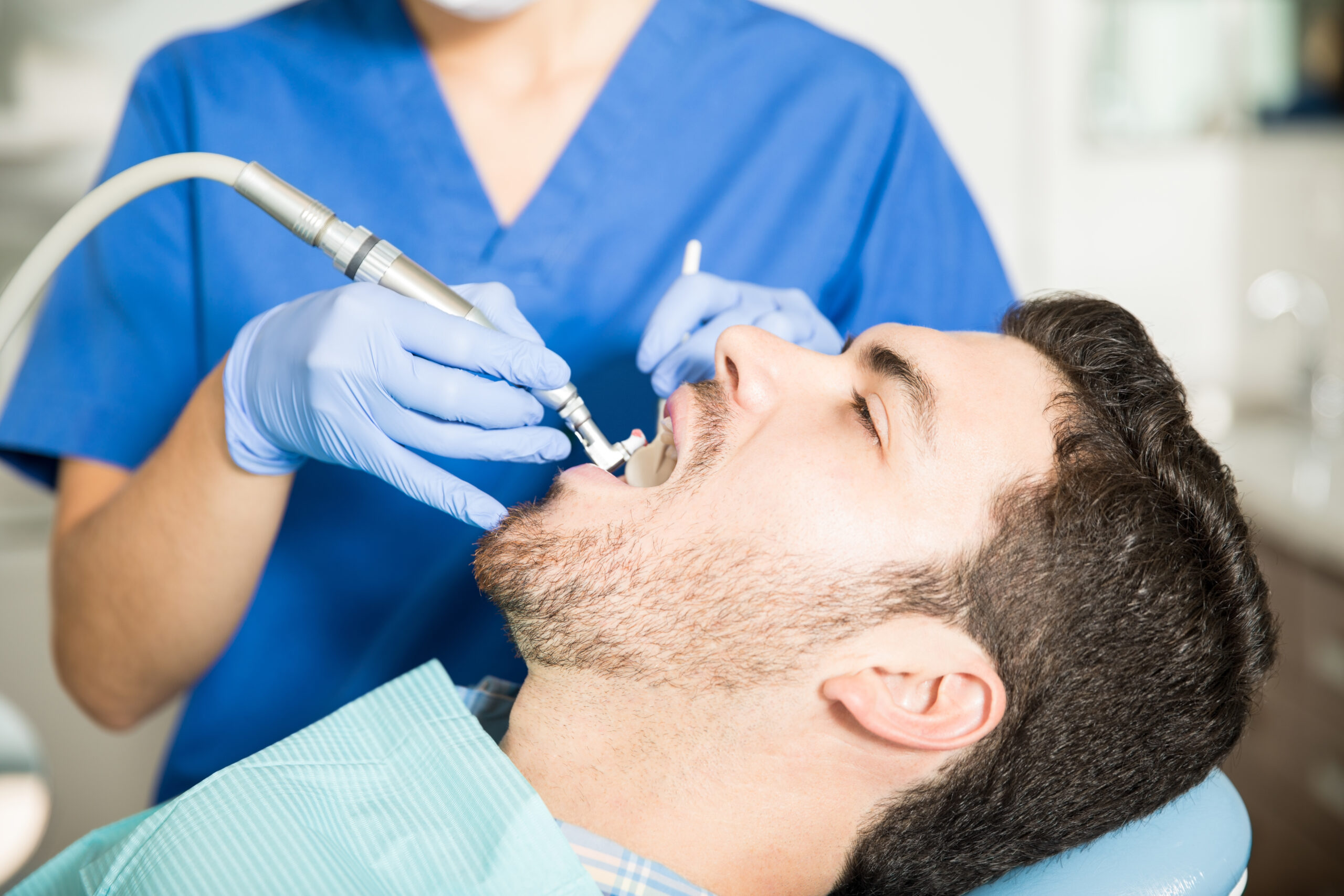 Man Receiving a Dental Cleaning in Indianapolis