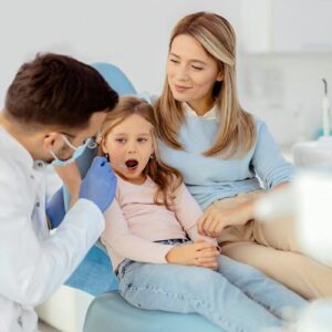 A young kid in a dental chair